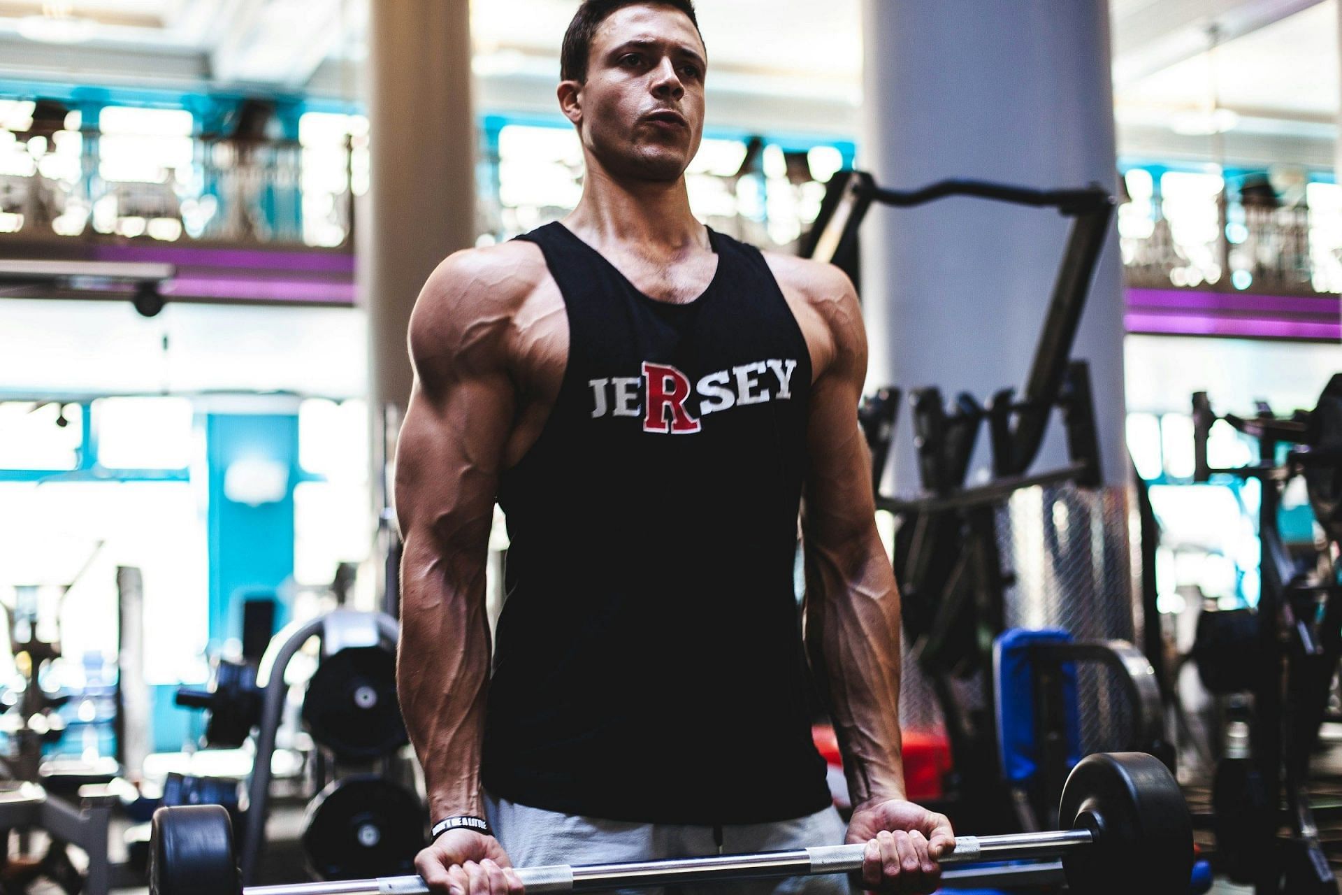 Arm Workout with dumbbells (Image via Unsplash/Total Shape)
